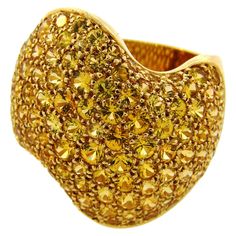 Here is your chance to purchase a beautiful and highly collectible designer ring. Truly a great piece at a great price! VAN CLEEF & ARPELS Yellow Sapphire 18 karat Yellow Gold Wave RING 1980s Elegant and classy ring created by Van Cleef & Arpels in France in the 1980s. Made of 18 karat yellow gold and pave set with one-hundred-eighteen round faceted yellow sapphires (total weight approximately 10.62 carats. The ring is 1 inch (2.5 cm) wide, the wave is 3/4 (1.8 cm) wide. It is size 6 (European 5 Vintage Van Cleef, Sapphire Gold Ring, Classy Ring, Onyx Cufflinks, Gold Wave Ring, Van Cleef & Arpels, Designers Jewelry Collection, Retro Bracelet, Vintage Cocktail Ring