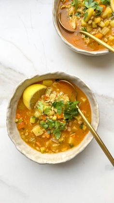 two bowls of soup with chopsticks on the side