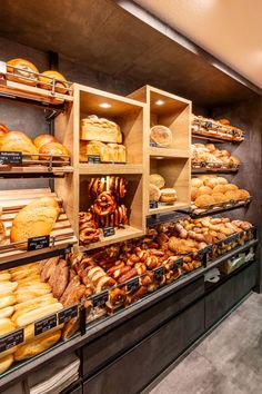 a bakery filled with lots of different types of bread