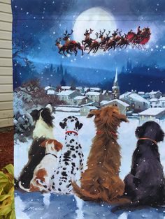 three dogs are sitting in the snow with santa's sleigh above them