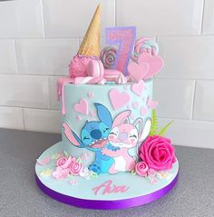 a cake decorated with pink and blue frosting