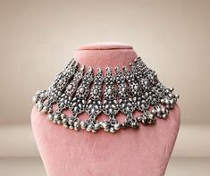 These Indian chokers is oxidized which is created with careful attention to detail. The designer neckpieces & its finishing gives it an elegant look & feel. This design is perfect for parties & functions as these chokers are specially designed for Indian Beautiful Brides -Base Metal- Silver, Brass -Plating- Oxidized Silver/Black Polish/Afghani -Stone- Pearls -Sizing-Non Adjustable -Type- Chokers -Light Weight -FREE Shipping -Gift Wrapping Available -Delivery from a Small Business in India -Handm Metal Choker With Oxidized Finish, Metal Choker For Gifts, Heavy Silver Metal Choker, Heavy Metal Choker For Gift, Heavy Metal Choker For Gifts, Wedding Metal Choker With Oxidized Finish, Metal Choker With Intricate Design For Festivals, Silver Choker With Intricate Design For Festivals, Traditional Silver Metal Choker