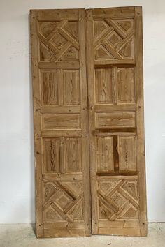 two wooden doors are open on the floor