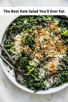 a white bowl filled with broccoli covered in parmesan cheese