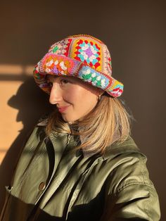 Adjustable Rainbow Hat For Festivals, Retro One-size Crochet Hat For Winter, Retro Crochet Hat One Size For Winter, Retro Winter Hat One Size, Colorful Bucket Hat For Spring, Winter Retro Curved Brim Bucket Hat, Winter Retro Brimmed Bucket Hat, Retro Brimmed Winter Bucket Hat, Retro Winter Bucket Hat With Curved Brim