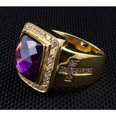 Made of stunning yellow gold the brilliance of this ring cannot be mistaken. With a huge violet amethyst stone as the focal point and many smaller crystals imbedded around it, the sparkle of this ring is unlike anything else. Two engraves crosses grace the side faces of the ring and are inlayed with sparking stones as well. Add some shine and brilliance to your biker jewelry collection today with this stunning piece! Ring width : ¾ x ¾ inch Ring weight : 30 grams material: .925 sterling silver / Spiritual Rings, Bishop Ring, Iron Cross Ring, Christian Rings, Christian Ring, Cross Rings, Engraved Cross, Biker Jewelry, Sterling Silver Rings Bands