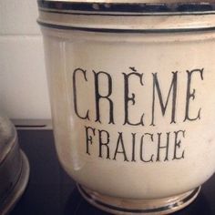 a white creme container sitting on top of a counter