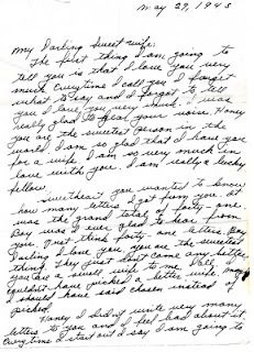 an old handwritten letter is shown in black ink with writing on the bottom corner