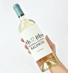 a person holding a bottle of wine with the label on it that says because wedding planning