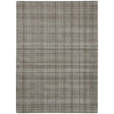 a gray rug with a checkered pattern on the front and back side, in two different colors