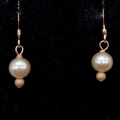 Creamy Satiny White Freshwater Pearls 14k Rose Gold Filled Earrings! This is for one pair of beautiful satiny Freshwater pearl EARRINGS. These enchanting & captivating earrings will compliment any skin tone. The pearls are a beautiful creamy white accented with beautiful Rose Gold!! NOTE: Images do not reflect number and size. Please see detail and table for information. Quantity: 1 pair of earrings Material Type: Fresh Water Pearls, 14k Rose Gold Filled Earrings Size: 6mm (Pearls) Length: 1 Elegant Rose Gold Pearl Earrings Hypoallergenic, Elegant Rose Gold Hypoallergenic Pearl Earrings, Adjustable Rose Gold Earrings For Formal Occasions, Adjustable Rose Gold Earrings For Formal Events, Formal Rose Gold Earrings, Hypoallergenic Rose Gold Pearl Earrings, Rose Gold Pearl Earrings With Ear Wire For Anniversary, Classic Rose Gold Hypoallergenic Pearl Earrings, Classic Hypoallergenic Rose Gold Pearl Earrings