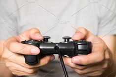 a person holding a video game controller in their hands