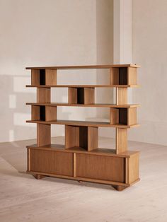 a wooden shelf sitting on top of a hard wood floor