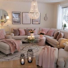 a living room filled with furniture and a chandelier