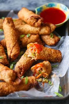 some fried food is on a tray with ketchup