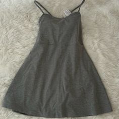 This Is A Brand New With Tags Gray Tennis Dress That Is Both Functional And Fashionable On The Court. I Am Moving To A Smaller Space So I Am Giving Away My Clothes. Casual V-neck Dress With Built-in Bra, Casual Midi Dress With Built-in Bra, Casual Mini Dress With Built-in Bra, Gray A-line Mini Dress For Spring, Solid Stretch Cotton Dresses, Casual Fitted Mini Dress With Built-in Bra, Casual Stretch Dresses With Spaghetti Straps, Spring Cotton Dress With Built-in Bra, Fitted Gray Casual Dress