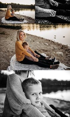 a woman sitting on top of a blanket next to a little boy in front of a body of water