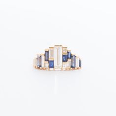 Artemer does it again with this geometric piece of perfection. Both diamond and sapphire baguettes combine to create a staggering, shimmering silhouette. Wear it solo as a modern engagement ring or pair it with a plain or textured gold band. Made in Israel. 18 karat yellow gold with 0.65 carat E/VVS2 white baguette-cut Modern Engagement Ring, Tiara Ring, Diamond Tiara, Baguette Diamond Rings, Modern Engagement Rings, Engagement Style, Baguette Cut Diamond, Sapphire Earrings, Baguette Cut