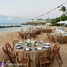 tables set up on the beach for an event