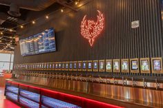 an empty bar with several menus on the wall