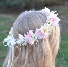 a blonde girl with flowers in her hair