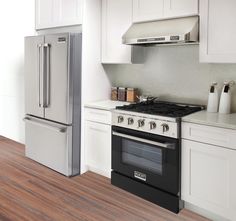 a kitchen with an oven, refrigerator and dishwasher is shown in this image