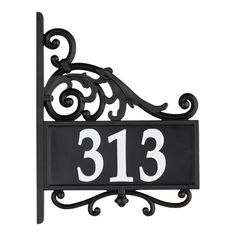 a black and white house number sign