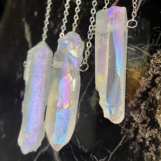 Wear this Angel Aura Quartz necklace and align, embody and own everything you are like it’s your only job! You are perfect AS IS and always will be. Angel aura quartz is a magical, harmonious stone that works to bring peace, joy, and optimism to your spirit. Aura quartz crystal pendant - size range: 1-2" length x.25" width Choose your favorite chain, refer to listing image to see them~1.5mm 14k gold fill cable, 14k gold fill satellite, sterling silver cable, sterling silver satellite, antique br Angel Aura Quartz Necklaces, Boho Pendant Necklace, Aura Quartz Crystal, Quartz Crystal Pendant, Angel Aura Quartz, Quartz Crystal Necklace, Angel Aura, Boho Pendant, Mala Necklace