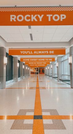 an orange sign that says rocky top you'll always be home sweet home to me