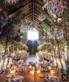 the inside of a building decorated with flowers and candles