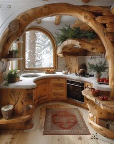 a kitchen with wooden cabinets and an arched window in the center is filled with greenery