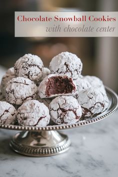 chocolate snowball cookies on a silver platter with the words, chocolate snowball cookies with chocolate center