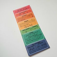 a multicolored sticker with arabic writing on it's side and the words written in different languages