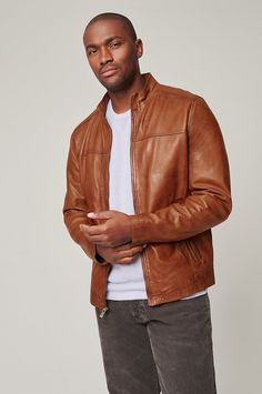 Lightweight and built for spring, the Lucio jacket is made from premium lambskin leather with a unique two-tone waxed finish. This sporty zip-front moto style is fully lined for comfortable all-day wear and features a modern stand collar for added protection on windy days. Sturdy metal zippers and two pockets make this genuine lambskin leather jacket a perennial favorite. Fitted Leather Outerwear With Stand Collar, Brown Leather Biker Jacket With Stand Collar, Spring Leather Outerwear With Stand Collar, Modern Leather Biker Jacket For Spring, Spring Modern Leather Biker Jacket, Moto Leather Outerwear With Zipper Closure, Leather Moto Outerwear With Zipper Closure, Spring Moto Leather Jacket, Mens Fur Coat