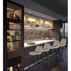 a kitchen with bar stools next to the counter and shelves full of dishes on it