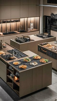 an image of a kitchen setting with food on the stove top and oven in the middle