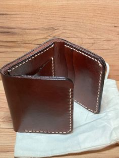 Leather Trifold wallet, Mahogany in color, 5 card slots, 1 Hidden compartments, cash slot Brown Trifold Card Holder For Everyday Use, Classic Brown Trifold Card Holder, Brown Bifold Coin Purse With Card Slots, Brown Trifold Wallet With Card Slots, Brown Trifold Wallet With Coin Pocket, Brown Trifold Wallet For Daily Use, Brown Trifold Card Holder With Interior Slots, Trifold Brown Coin Purse With Card Slots, Brown Trifold Coin Purse With Card Slots