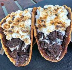 two desserts with oreo cookies and marshmallows on them