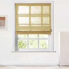 a white room with an open window and beige blinds