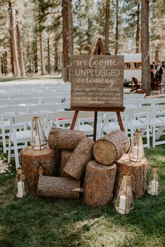 a sign that says unplugged is surrounded by logs