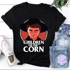 Product details: ✔️ NAME: Children Of The Corn T-Shirt, Isaac Chroner Shirt, Horror Movie Vintage Shirt, Halloween Unisex T-Shirt, Halloween Shirt, Horror Movie Shirt ✔️ IMPORTANT NOTE: Both Men and Women can we our shirts because this is unisex style t-shirts;  Wash item inside out in cold water, do not bleach, do not dry clean, do not iron directly on the design. ✔️ MATERIAL: 5.3-ounce, 100% cotton (99/1 cotton/poly (Ash) & 90/10 cotton/poly (Sport Grey); Heavyweight classic unisex tee; Taped neck and shoulders; Tearaway label; Decoration type: Digital Print ✔️ OUR DESIGN PRODUCTS: Each One are designed and sold in limited quantities. The designs are created by our incredibly talented in house graphic art team who often hand draw and illustrate each Tee shirt design. ✔️ SIZE CHART: Pleas Fall Pop Culture T-shirt With Character Print, Pop Culture Fan Merchandise Shirt For Halloween, Pop Culture Cotton T-shirt For Halloween, Pop Culture Halloween Cotton T-shirt, Halloween Pop Culture Cotton T-shirt, Pop Culture Halloween Fan Merchandise Shirt, Halloween Pop Culture Fan Merchandise Shirt, Black Halloween Fan Apparel Tops, Pop Culture Cotton Shirt For Halloween