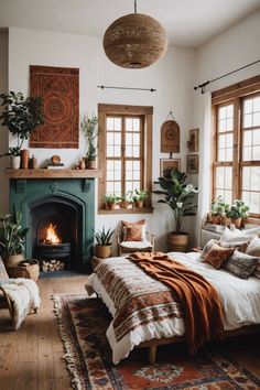 a bedroom with a fireplace and lots of plants