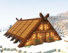 a house made out of wood in the snow