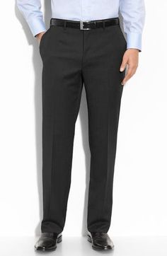 Italian wool adds a luxe style to staple flat-front trousers that offer a smart, modern look. 11" front rise; 17 1/2" back rise (size 60) 100% wool Dry clean Made in Italy Full Length Wool Suit For Business, Wool Full-length Business Suit, Black Wool Business Pants, Full Length Wool Business Suits, Black Wool Pants For Business, Black Wool Pants For Business Casual, Black Wool Bottoms For Business Casual, Semi-formal Black Wool Dress Pants, Black Dress Pants With Concealed Placket For Business