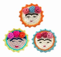 three crocheted coasters with fridados on them, one in the shape of a woman's face