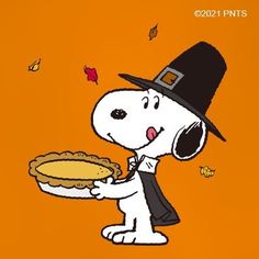 a cartoon dog holding a pie in his hand and wearing a black hat on an orange background