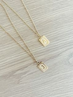 Experience the luxury of our 18k gold-plated stainless steel Initial Necklace! Free of lead and nickel, with a 16-inch chain and a 4-inch extender, you'll be stylishly adorned for any occasion. Trendy Gold Chain Necklace With Round Pendant, Gold Metal Initial Pendant Necklace, Gold Metal Pendant Initial Necklace, Rectangular Pendant Initial Necklace With Adjustable Chain As Gift, Gold Jewelry With Rectangular Metal Pendant, Gold Metal Jewelry With Rectangular Pendant, Trendy Gold Pendant Chain Necklace, Trendy Stainless Steel Necklace With Delicate Chain, Gold Stainless Steel Round Pendant Necklace