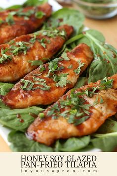 grilled chicken wings on lettuce with sauce and parsley in the middle