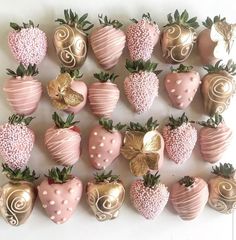 chocolate covered strawberries are arranged in the shape of hearts and swirls on a white surface