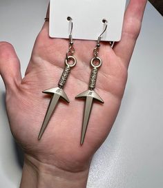 Naruto Shippuden anime-inspired earrings with a silver pendant of Minato Namikaze's kunai, the Flying Raijin, on a nickel-free hook.  comes with a couple Naruto stickers  Gift wrap option available - item wrapped in tissue inside a box tied with ribbon - add at checkout.  Made in Eugene, OR Flying Raijin, Minato Namikaze, Naruto Anime, Naruto Shippuden Anime, Anime Inspired, Naruto Shippuden, Gift Wrap, Silver Pendant, Jewelry Earrings Dangle